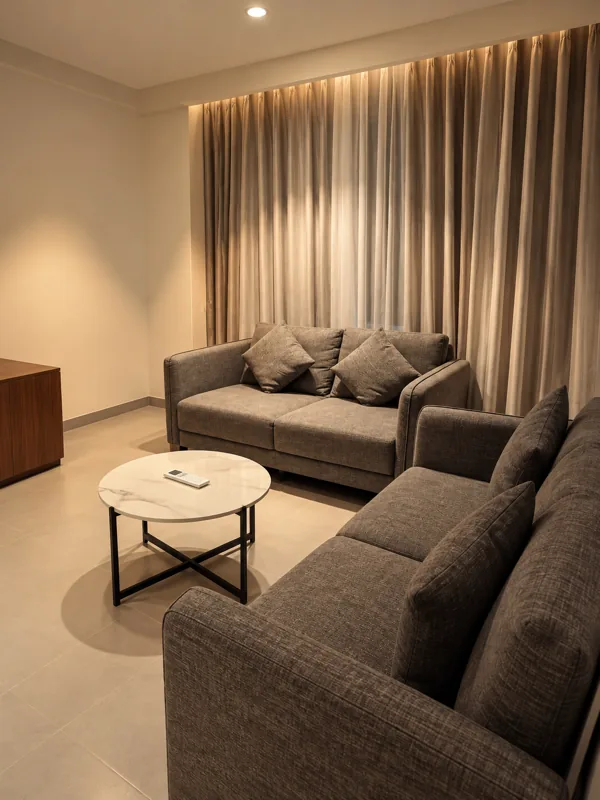 Suite Room living area with sofas at Amāra Hotel, Nizamabad