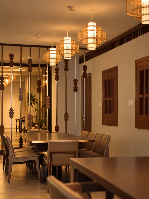 Dining area with carved wooden screens at Telugu Theory